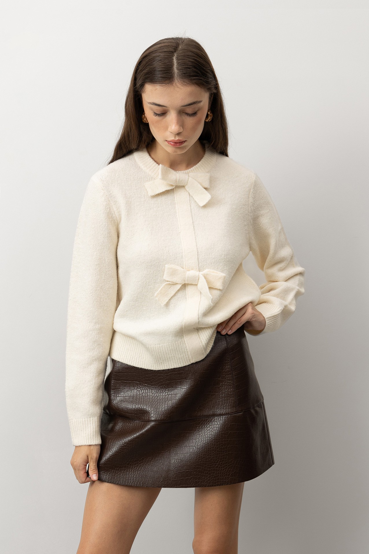 Camisola tricotada com laos