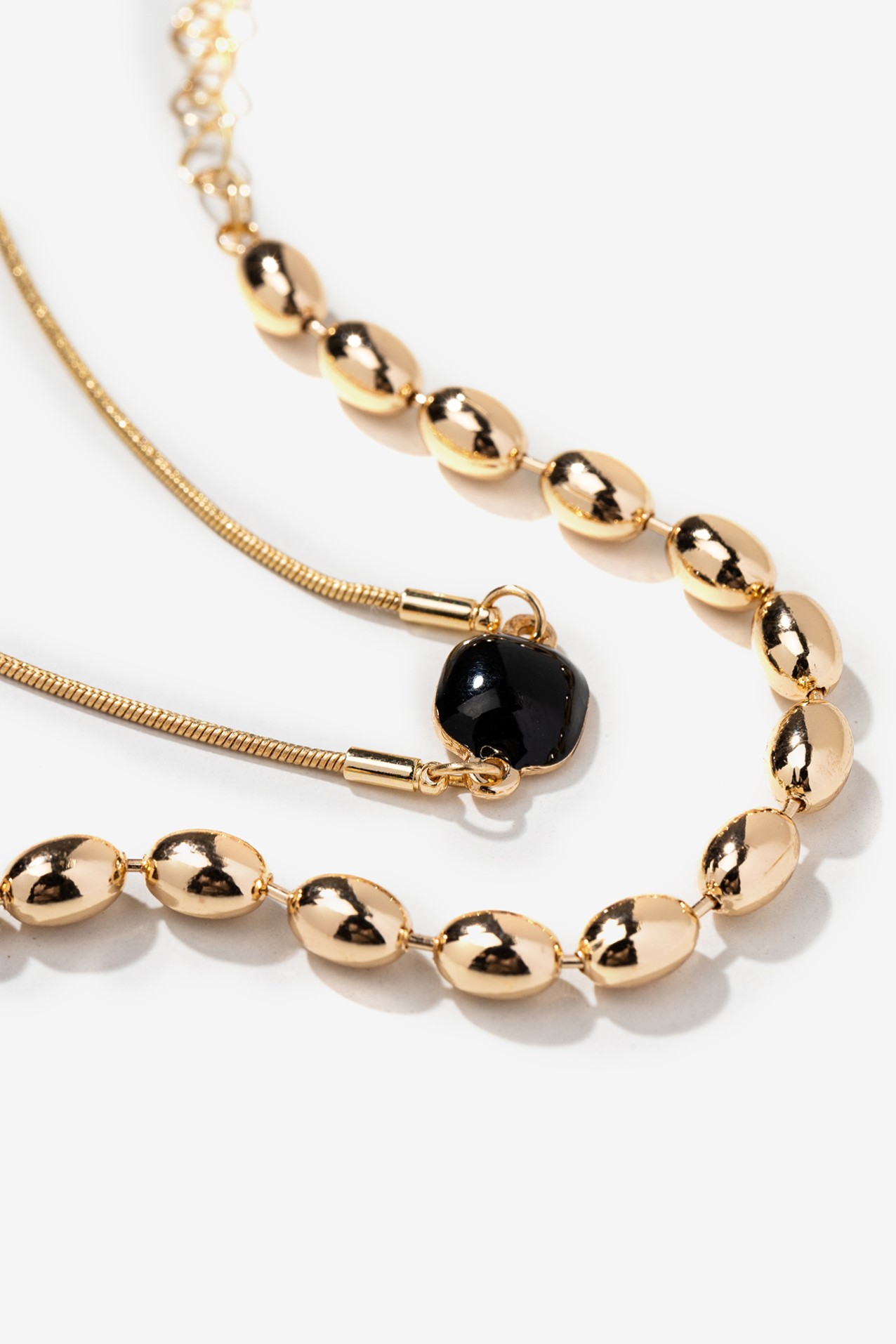 Gold Bracelet with Black Stone