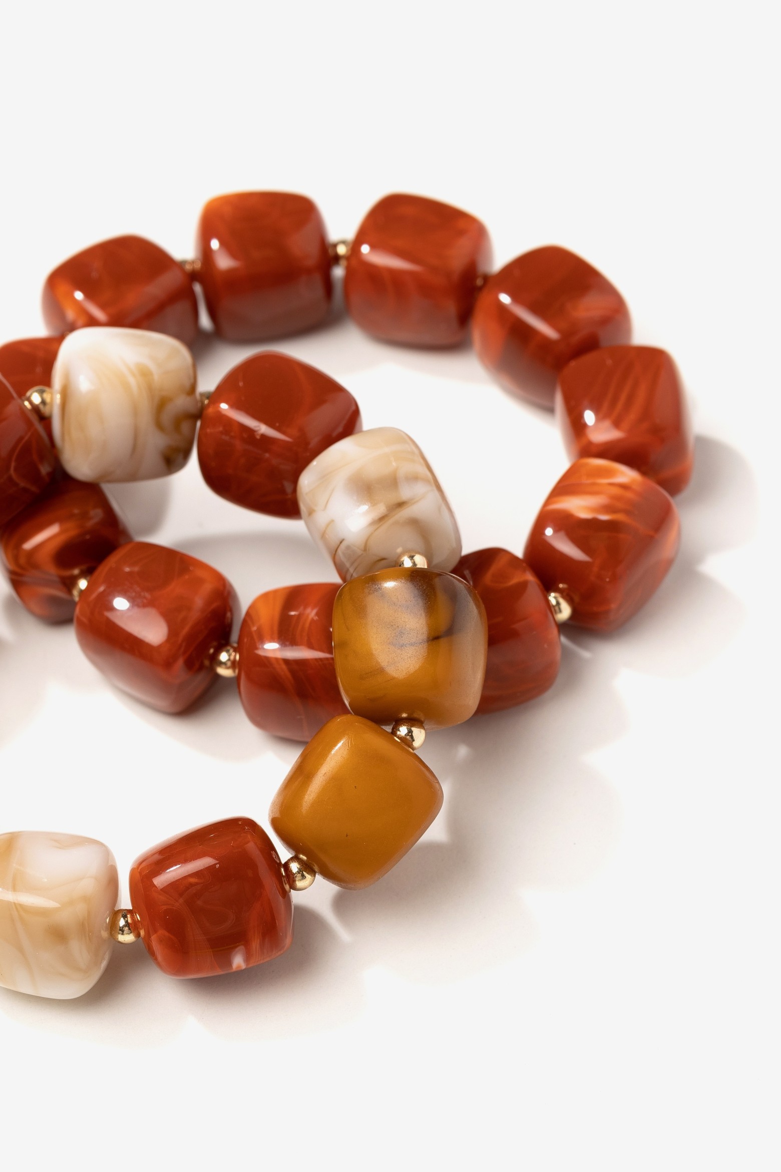 Chunky golden-toned bracelets